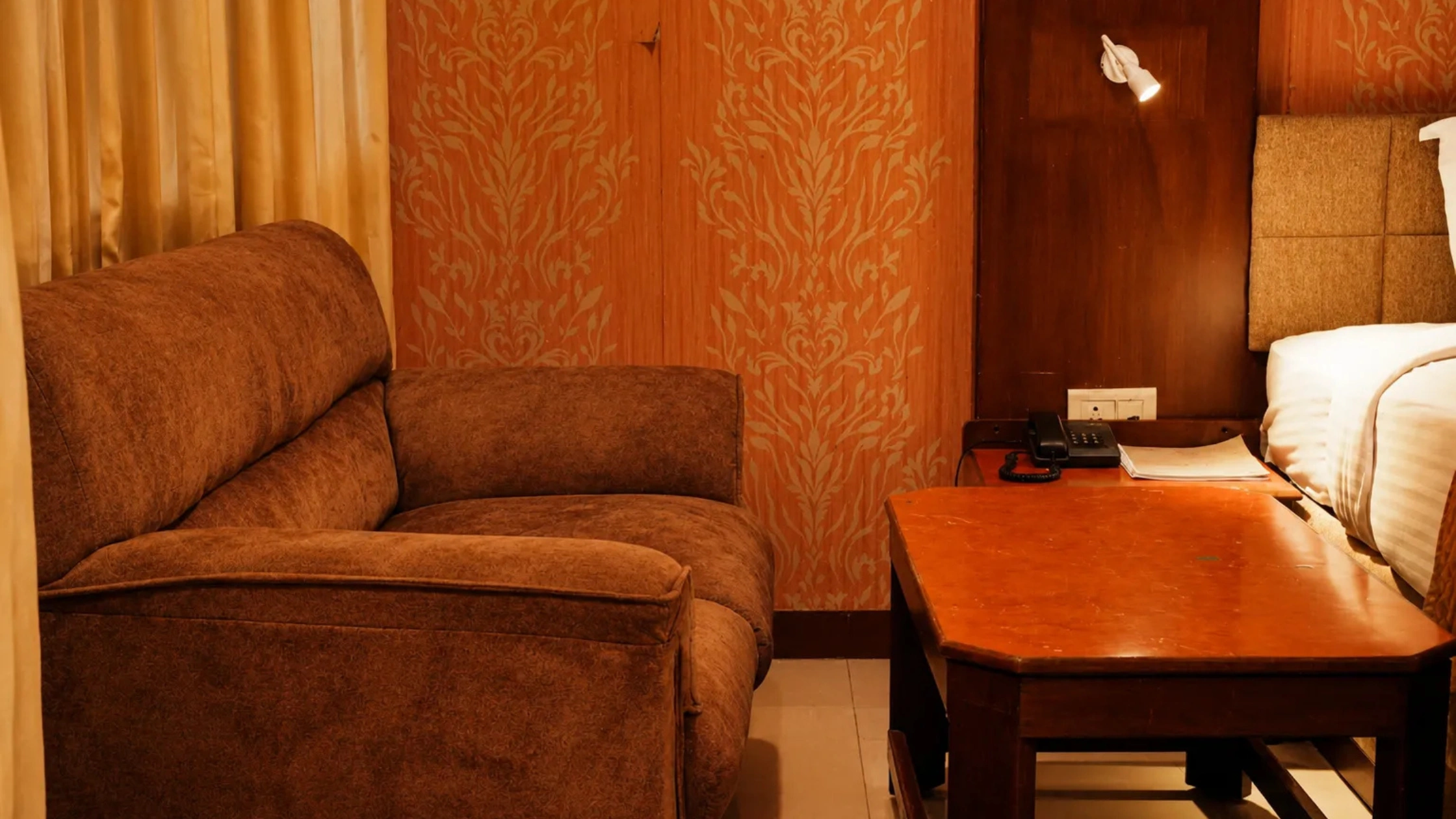 Comfortable hotel room with king-size bed and elegant interiors in Mysore.